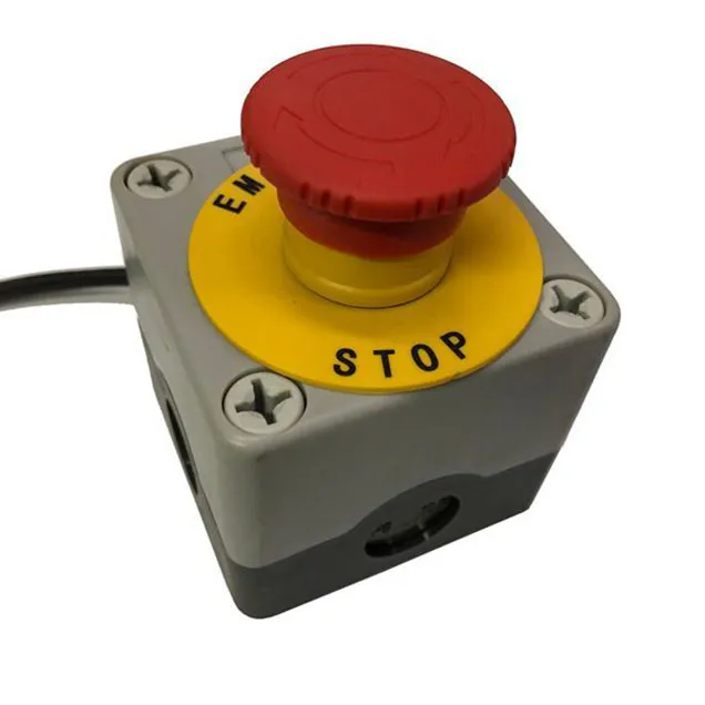 Prominent emergency stop button on a metal shredder